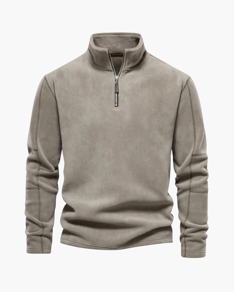 Lã encorpada, gola alta e fechamento frontal. Pulôver ideal para frio com visual refinado e versátil para qualquer ocasião.