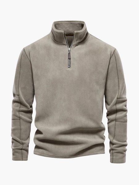 Lã encorpada, gola alta e fechamento frontal. Pulôver ideal para frio com visual refinado e versátil para qualquer ocasião.