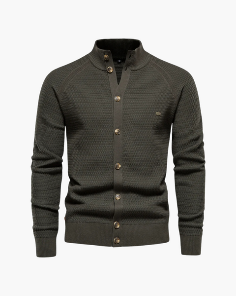 Detalhe da malha estruturada em algodão verde com padrão elegante, perfeito para visuais clássicos masculinos.
