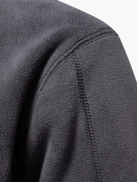 Casaco grosso de lã com zíper frontal e acabamento fino. Ideal para visuais sofisticados, discretos e atemporais.