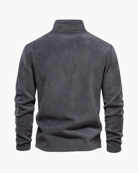 Textura fleece premium em close, destacando o conforto térmico e a qualidade refinada.