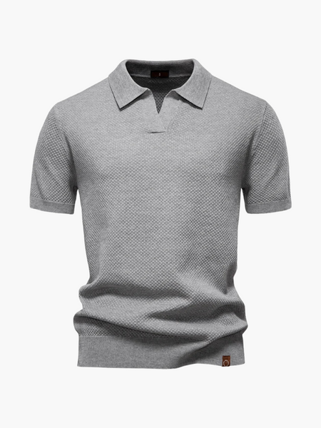 Camisa polo clássica verde escura, ideal para dias quentes com elegância
